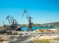 Landscape of tugboats and cranes in shipyard in coast Royalty Free Stock Photo