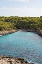 Landscape with turquoise, azure sea water on a sunny day, Cala Mondrago, Majorca island, Spain Royalty Free Stock Photo