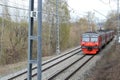 Landscape with a two-way railway with rails, with a train. with electricity poles.