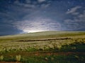 LANDSCAPE UNDER THE MOONLIGHT WITH CLOUDS AND STARS Royalty Free Stock Photo