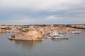 Landscape of Valletta city and its harbour with luxury yachts in Malta viewed from Upper Barrakka Gardens fort