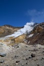 Landscape. The valley of fumaroles with the eruption of boiling water vapor and boiling sulfur