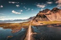 Landscape of Vestrahorn mountain with dirt road on black sand beach at Stokksnes, Iceland Royalty Free Stock Photo