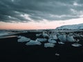 Landscape View Of The Amazing Jokulsarlon Beach Diamond Beach With Giant Ice Rocks On The Lava Black Beach, Shine Like