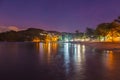 Landscape view of Anse a lÃ¢â¬â¢Ane sandy beach with palm trees and calm bay at colorful dusk with peaceful Caribbean sea, Martinique Royalty Free Stock Photo