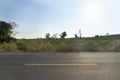 Landscape view of beside asphalt road and yellow line in center. Royalty Free Stock Photo