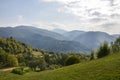 Landscape view on the beautiful hill with houses and trees in morning mountains near the Kvasy village. Carpathians Royalty Free Stock Photo