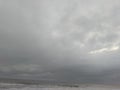 landscape view of black sand beach with dark sky covered with clouds Royalty Free Stock Photo