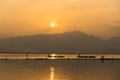 Landscape view - boatman paddle boat in the lagoon lake.Kwan phayao in evenign time at phayao thailand