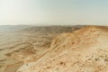 Landscape of view from canyon dry desert in Israel. Valley of sand, rocks and stones in hot middle east tourism place. Royalty Free Stock Photo