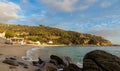 landscape view of Cavoli Beach on Elba in warm evening light and boulders in the foreground Royalty Free Stock Photo