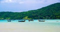 Landscape view of coastline with limestone rock and boats on ocean at Ko Phi Phi islands, Thailand. Concept of exotic tropical Royalty Free Stock Photo