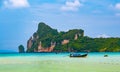 Landscape view of coastline with limestone rock and boats on ocean at Ko Phi Phi islands, Thailand. Concept of exotic tropical Royalty Free Stock Photo