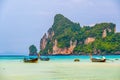 Landscape view of coastline with limestone rock and boats on ocean at Ko Phi Phi islands, Thailand. Concept of exotic tropical Royalty Free Stock Photo