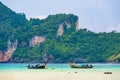 Landscape view of coastline with limestone rock and boats on ocean at Ko Phi Phi islands, Thailand. Concept of exotic tropical Royalty Free Stock Photo