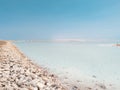 Landscape view on Dead Sea salt crystals formations, clear cyan green water at Ein Bokek beach, Israel Royalty Free Stock Photo