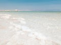 Landscape view on Dead Sea salt crystals formations, clear cyan green water at Ein Bokek beach, Israel Royalty Free Stock Photo