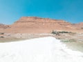 Landscape view on Dead Sea salt crystals formations, clear cyan green water and mountains at Ein Bokek beach, Israel Royalty Free Stock Photo