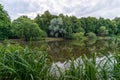 Landscape view on Desna river among greenery and trees in Russia in summer cloudy day