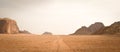 Vast desert lonely valley road in Wadi Rum, Jordan Royalty Free Stock Photo