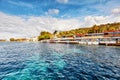 Landscape view of fish restaurants at the seashore on a sunny winter day in Gumusluk, Bodrum, Mugla, Turkey