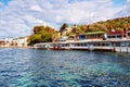 Landscape view of fish restaurants at the seashore on a sunny winter day in Gumusluk, Bodrum, Mugla, Turkey