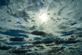 A landscape view of fluffy grey and white clouds in the sunny blue sky Royalty Free Stock Photo