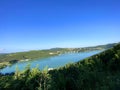 Landscape with a view of the forest, river and mountains. Houses on the hills near the river Royalty Free Stock Photo