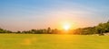 Landscape view of grass field with sunrise or sunset sky background