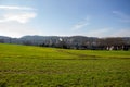 Landscape view of green grass field with blue skybackground