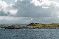 Harsh sea at Mortavika and the weather or radar station on the small hill, Norway Royalty Free Stock Photo