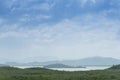 Landscape view of hills covered with trees. Surrounded by a large Prasae Reservoir. Royalty Free Stock Photo