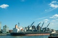 Landscape view of the historic Brooklyn Navy Yard, a freighter and cranes