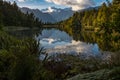 A landscape view of the incredibly beautiful Lake Matheson, New Zealand with the reflection of the stunning Southern Alps Royalty Free Stock Photo