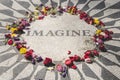 John Lennon`s memorial located at Central Park, New York surrounded by colorful flowers left by fans and tourists Royalty Free Stock Photo