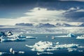 Landscape view of Jokullsarlon lagoon with floating ice and boat, Iceland