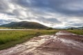 Landscape view of a lake surrounded by mountains and green savanna grassland, Pilanesburg Nature Reserve Royalty Free Stock Photo