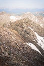 Landscape view of a man walking across the top of Quandary Peak. Royalty Free Stock Photo