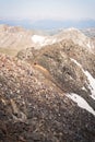 Landscape view of a man walking across the top of Quandary Peak. Royalty Free Stock Photo