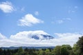 landscape view of mount Fuji enshrouded in cloud with clear blue sky