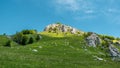 Landscape view of mountain, green grass meadow Royalty Free Stock Photo