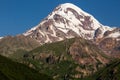 Landscape view of mountain Kazbeg on sunrise, Caucasus mountains, Country of Georgia Royalty Free Stock Photo