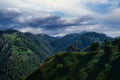 Landscape view of mountains with a forest under a cloudy sky on a sunny day in Pyrenees-Atlantiques Royalty Free Stock Photo