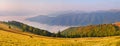 Landscape-view of the mountains at sunrise with sea fog in the v Royalty Free Stock Photo