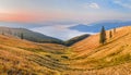 Landscape-view of the mountains at sunrise with sea fog in the v Royalty Free Stock Photo