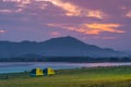 Landscape view of nature Camping tents near river lake with mountain range and beautiful twilight sunset Royalty Free Stock Photo