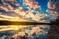 Landscape view of nature sunset or sunrise by sunbeam reflect with river water surface and cloudy sky over Mississippi river Royalty Free Stock Photo