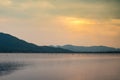 Landscape view of nature water river lake with mountain range and beautiful sunset sky background Royalty Free Stock Photo