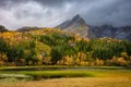 Landscape view of Nusfjord green hills and Autumn trees in Lofoten Islands, Norway at sunset