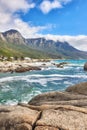 Landscape view of ocean beach, sea, clouds, blue sky with copy space on Camps Bay, Cape Town, South Africa. Tidal waves